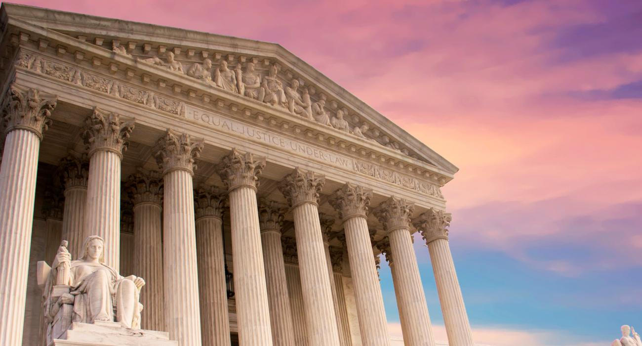 Supreme Court against sunset sky